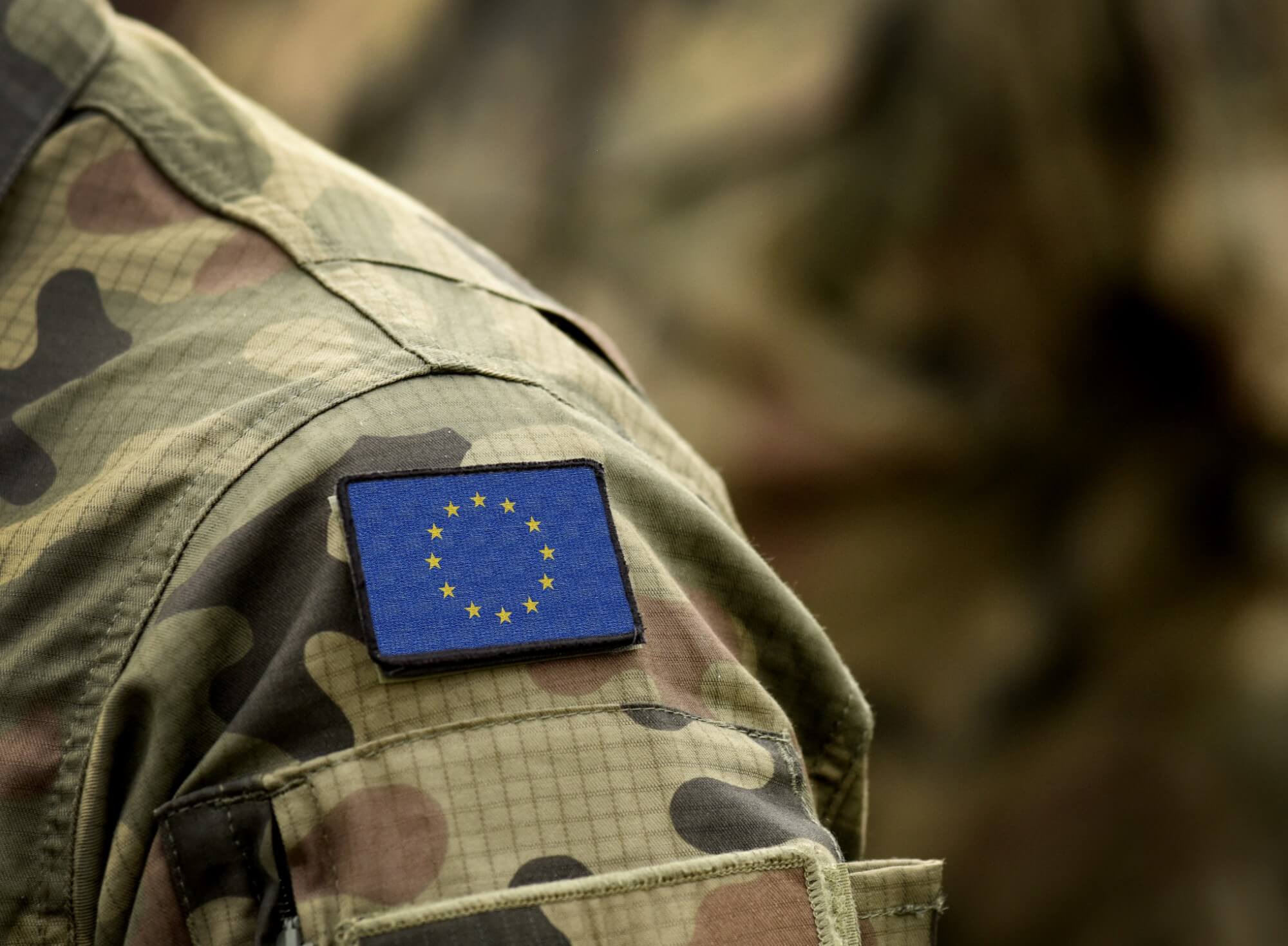 Close-up of a military uniform shoulder with a patch of the European Union flag, representing EU military forces or personnel